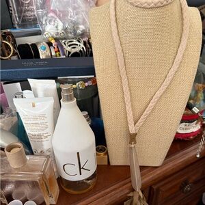 There’s 2Braided Taupe Leather Tassel Necklace the other is black braided